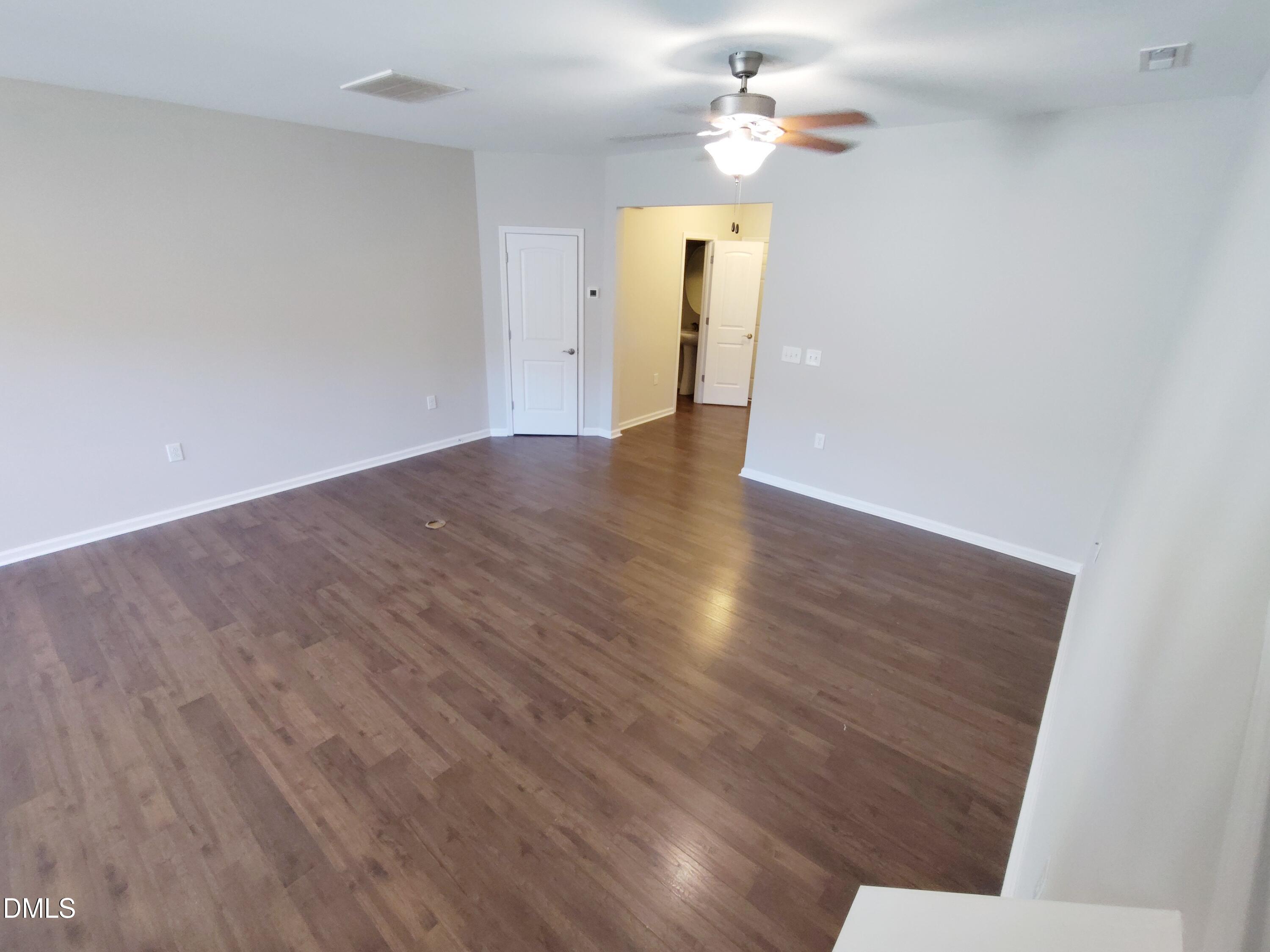1013 Kudzu Street Durham, NC 27713 - Photo 3 of 21 a view of a hallway with wooden floor