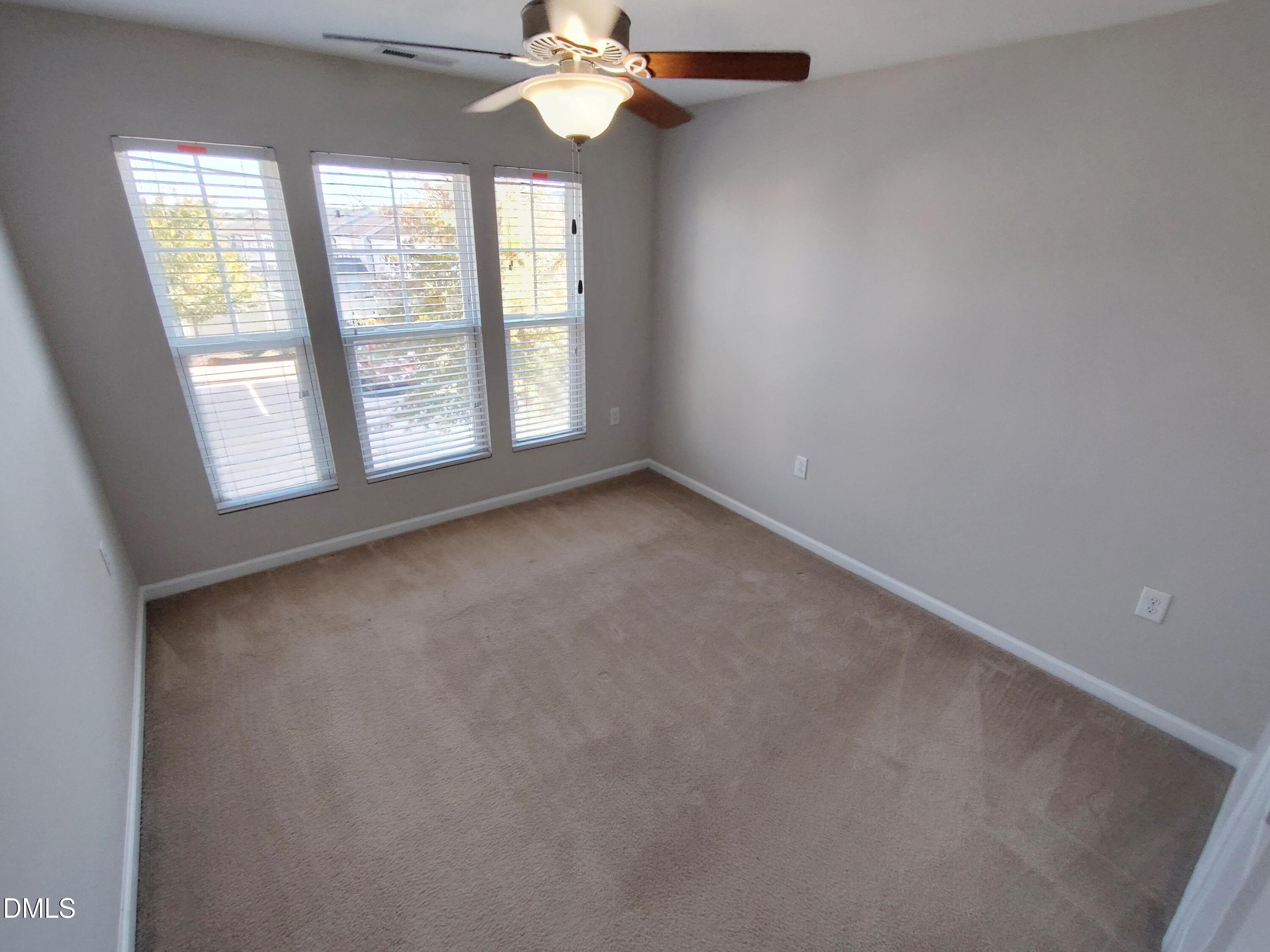 1013 Kudzu Street Durham, NC 27713 - Photo 10 of 21 an empty room with a window