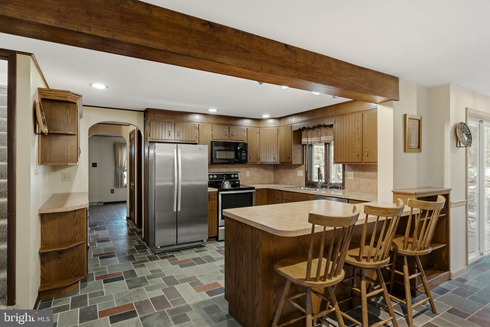130 Resh Road Reinholds, PA 17569 - Photo 24 of 58 a kitchen with granite countertop a refrigerator and a stove top oven
