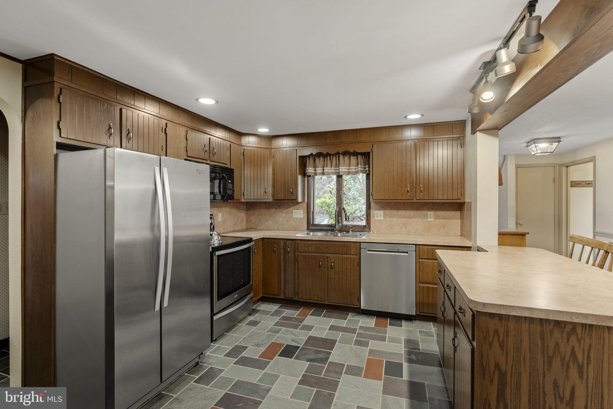 130 Resh Road Reinholds, PA 17569 - Photo 25 of 58 a kitchen with a refrigerator sink and cabinets