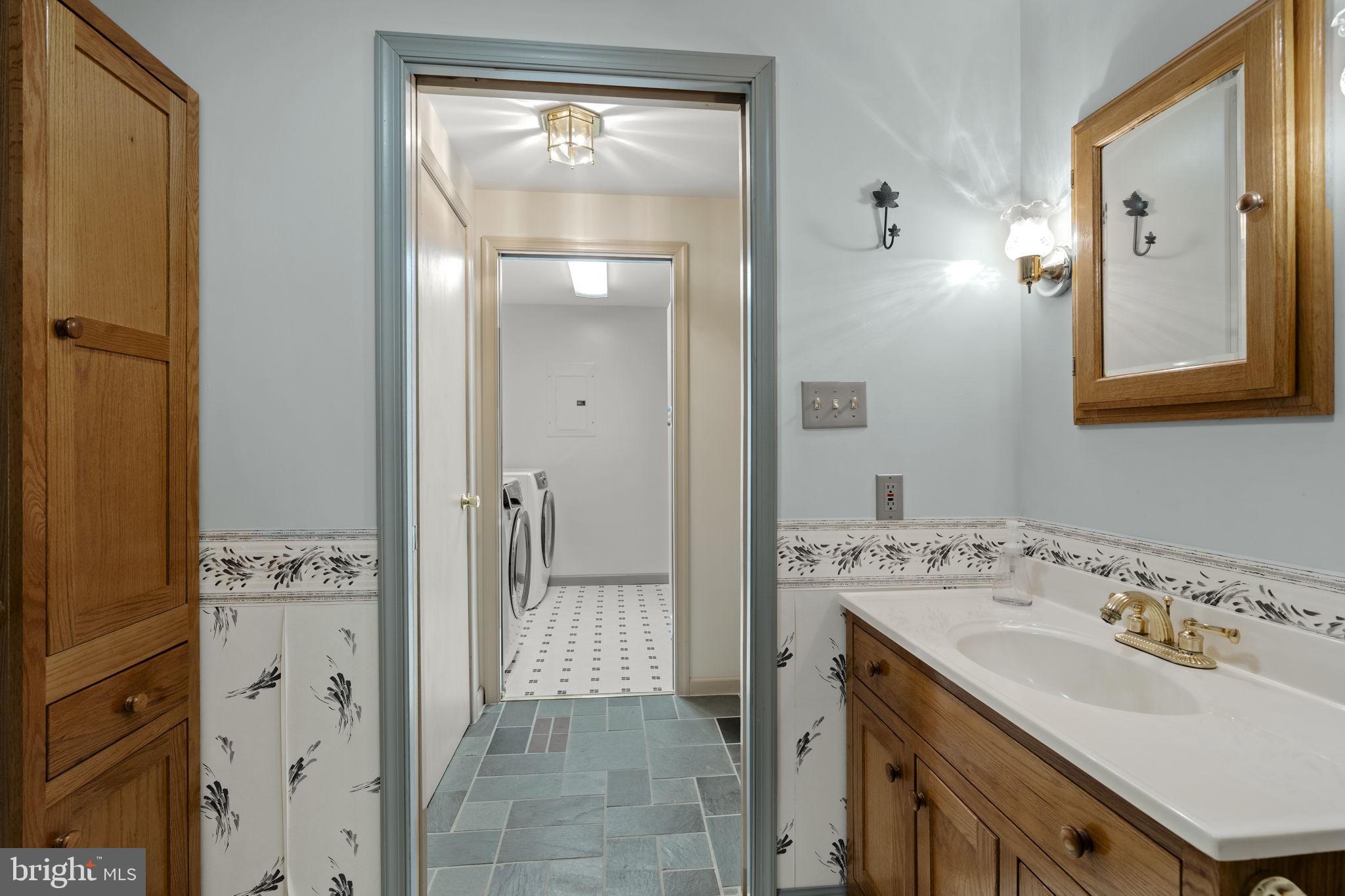 130 Resh Road Reinholds, PA 17569 - Photo 33 of 58 a bathroom with a sink a mirror and a shower