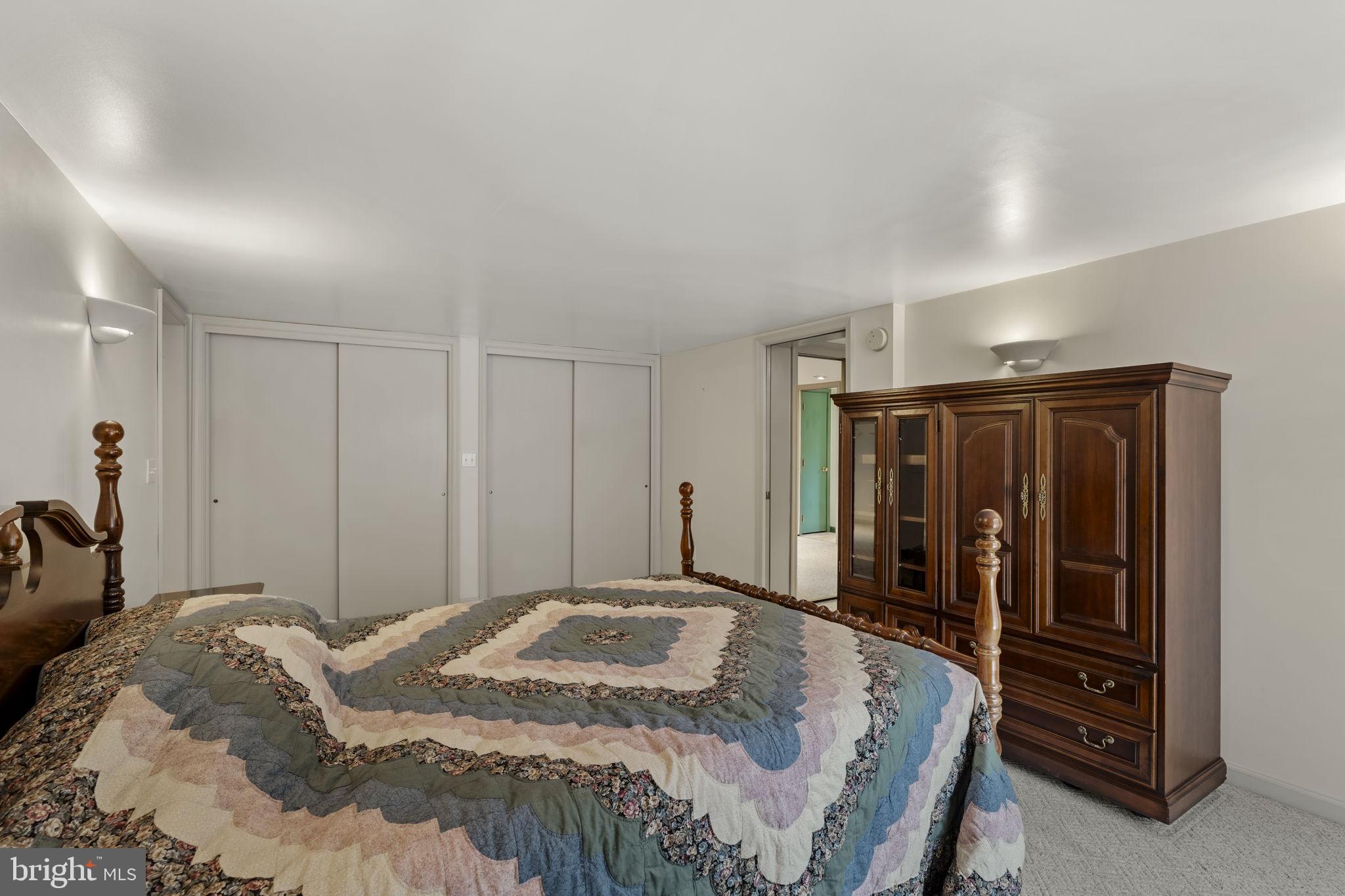 130 Resh Road Reinholds, PA 17569 - Photo 46 of 58 a bedroom with a bed and cabinets