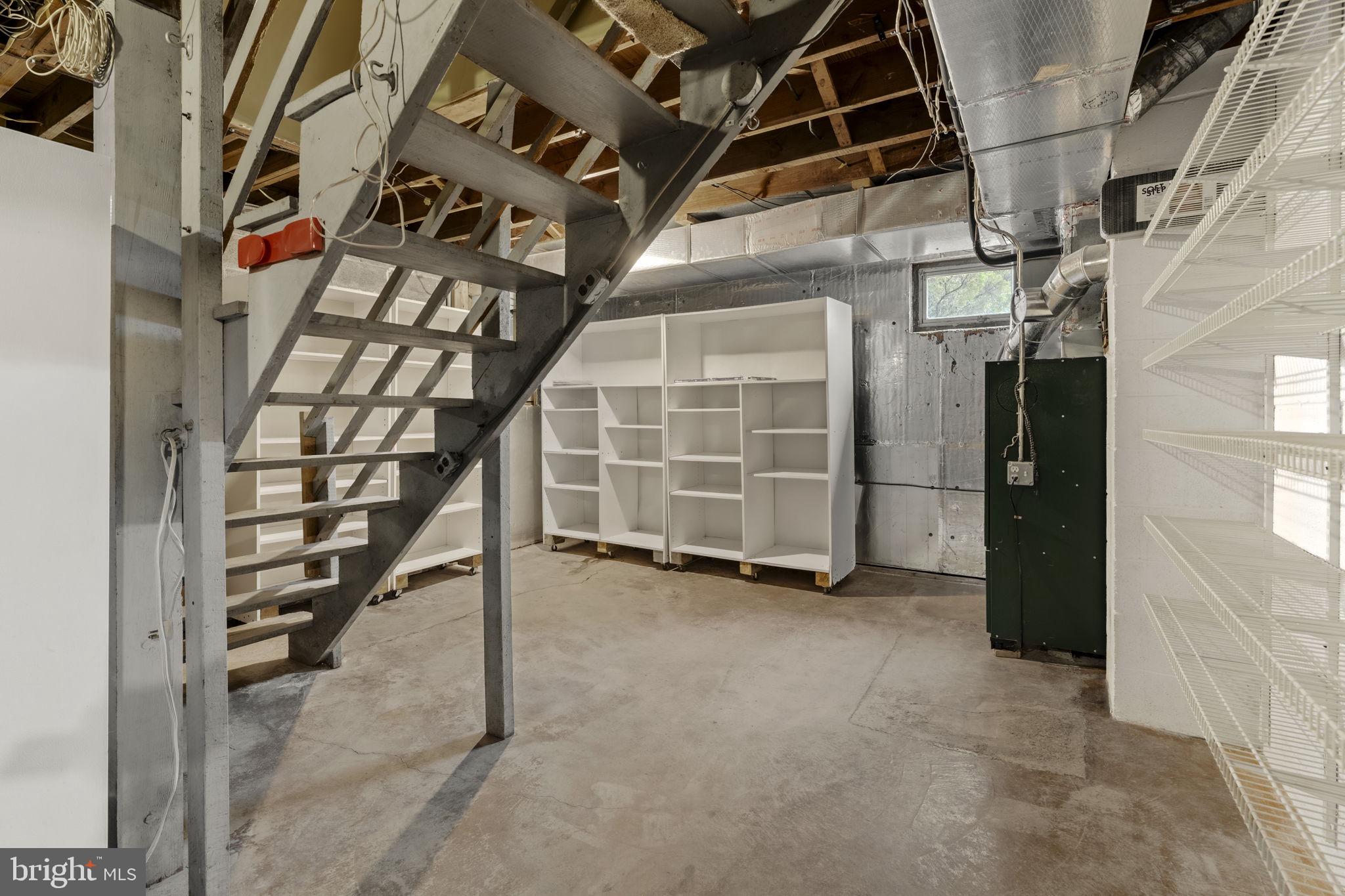 130 Resh Road Reinholds, PA 17569 - Photo 51 of 58 a view of an empty room with wooden floor and a staircase
