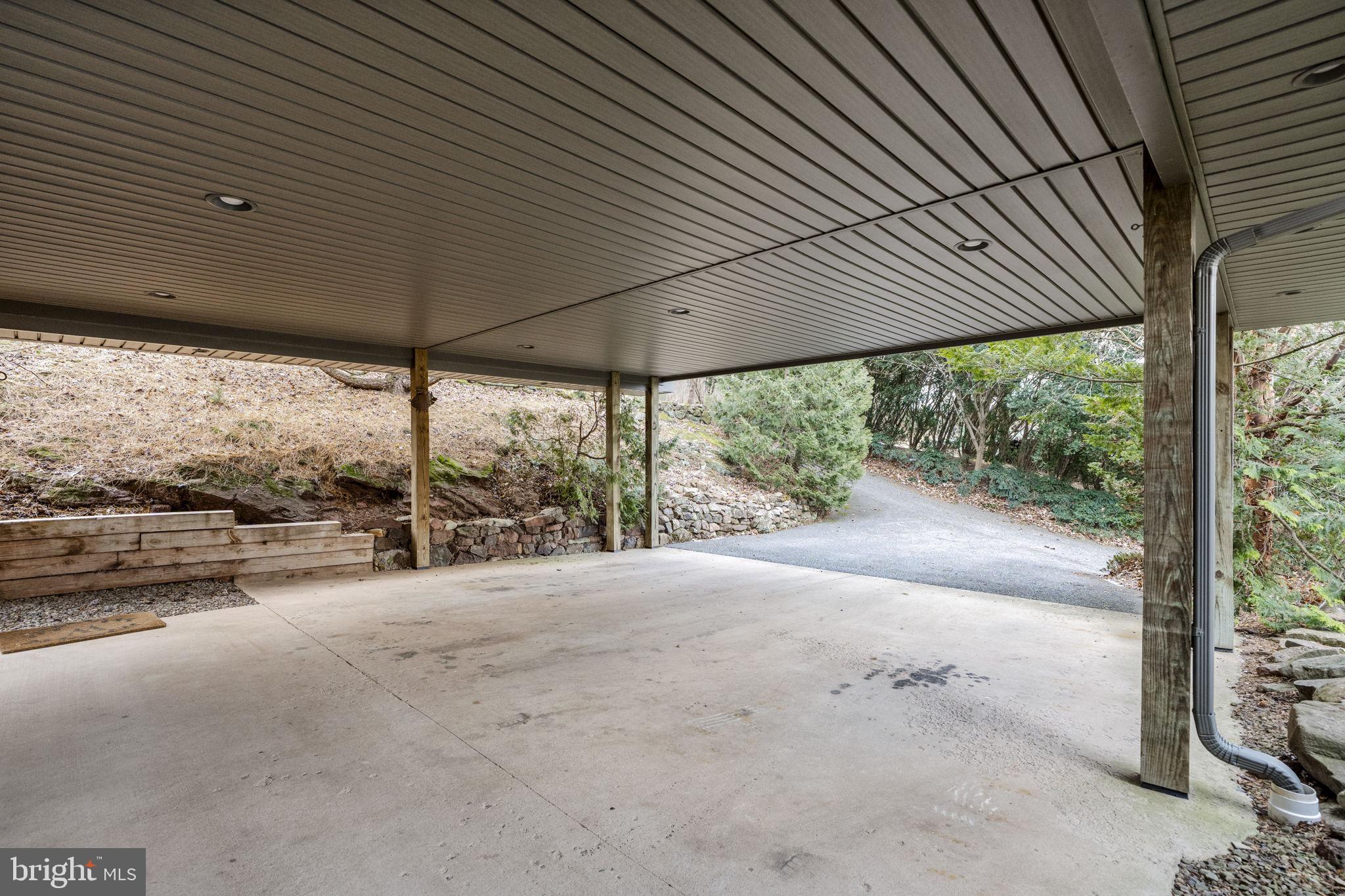 130 Resh Road Reinholds, PA 17569 - Photo 6 of 58 a view of a patio with a table and chairs under an umbrella