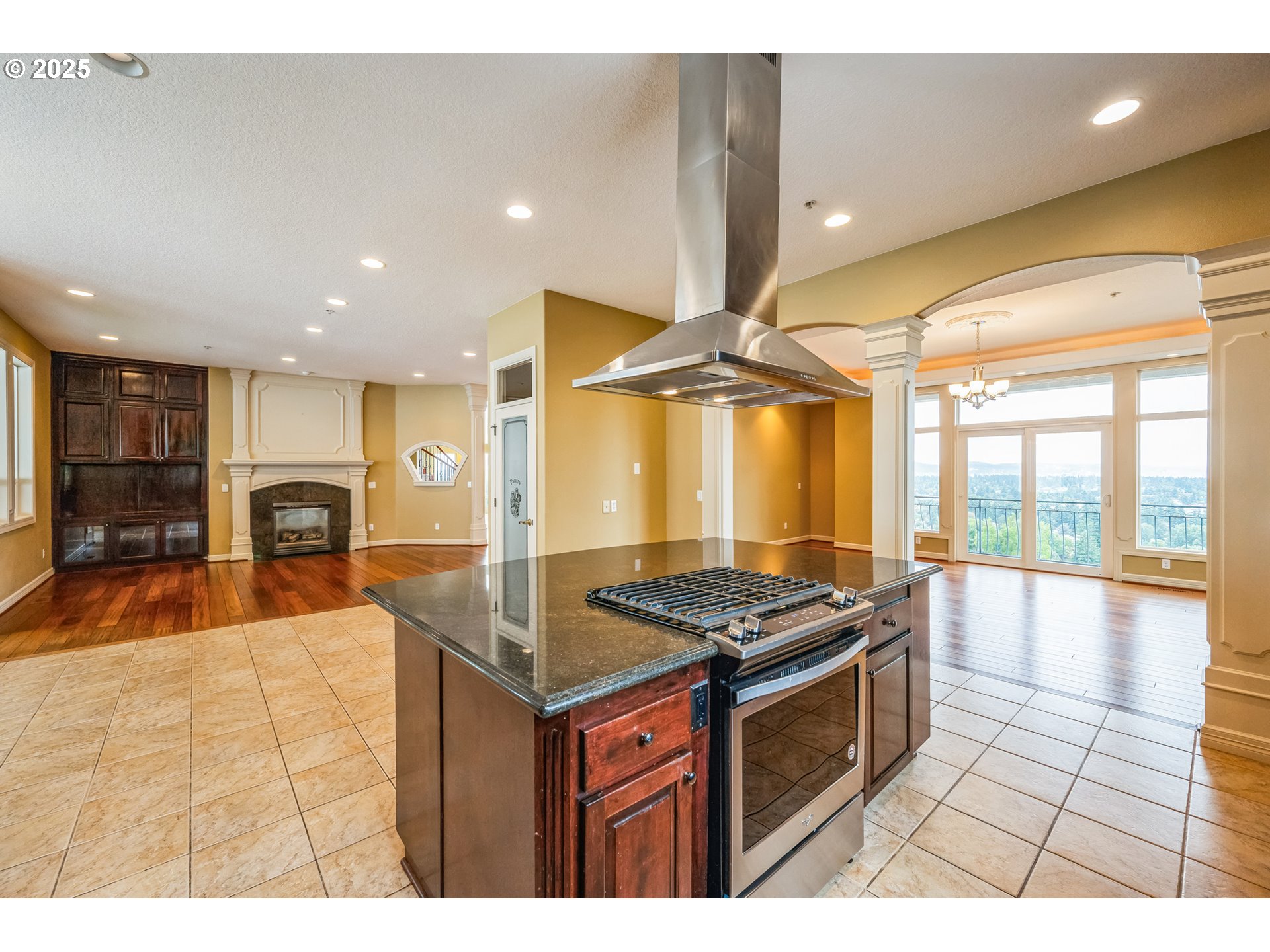 9340 Southeast Emmert View Court Happy Valley, OR 97086 - Photo 22 of 42 a kitchen with stainless steel appliances granite countertop a stove a sink and a microwave