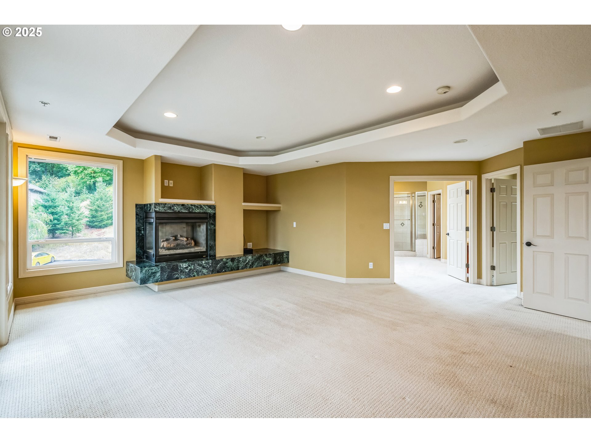 9340 Southeast Emmert View Court Happy Valley, OR 97086 - Photo 32 of 42 a view of empty room with furniture and a fireplace