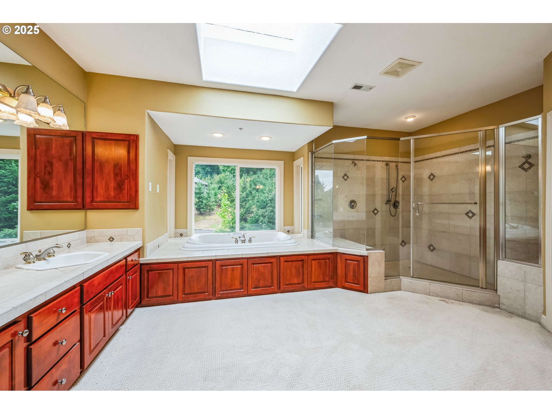 9340 Southeast Emmert View Court Happy Valley, OR 97086 - Photo 33 of 42 a large bathroom with a large tub and shower