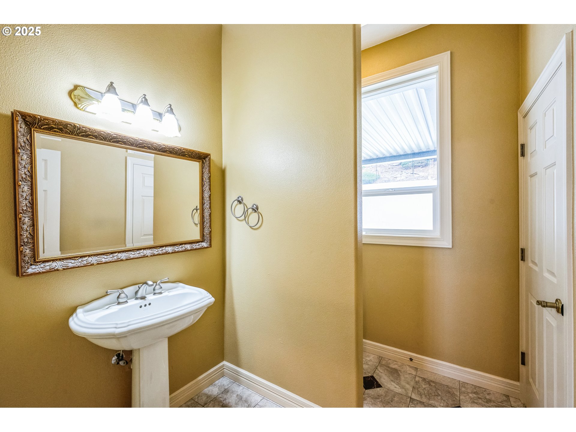 9340 Southeast Emmert View Court Happy Valley, OR 97086 - Photo 35 of 42 a bathroom with a sink and a mirror