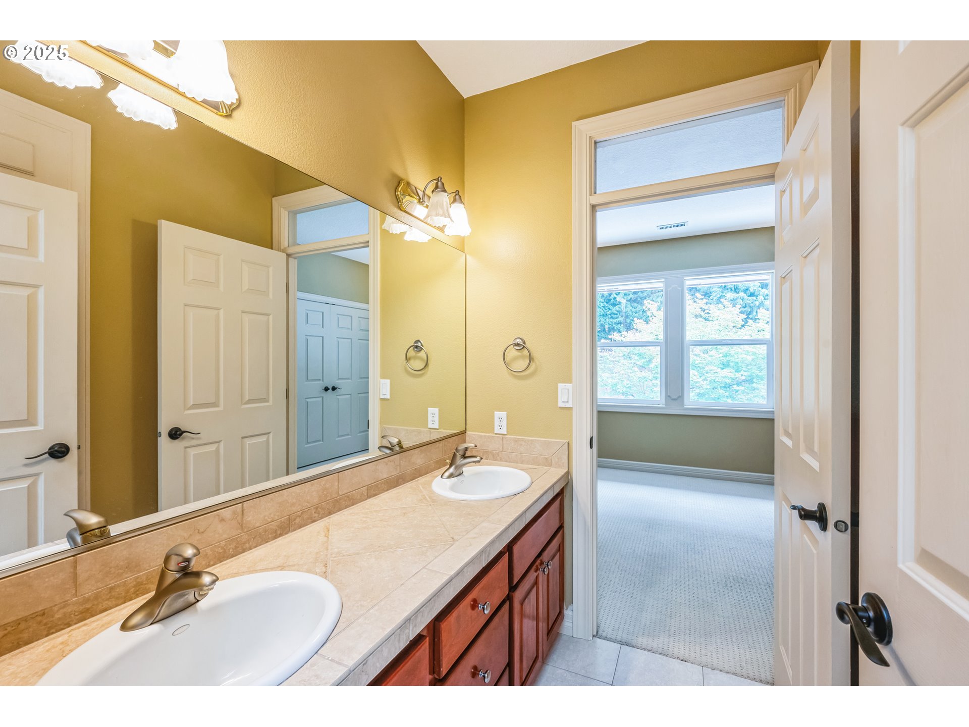 9340 Southeast Emmert View Court Happy Valley, OR 97086 - Photo 36 of 42 a bathroom with a sink and a mirror