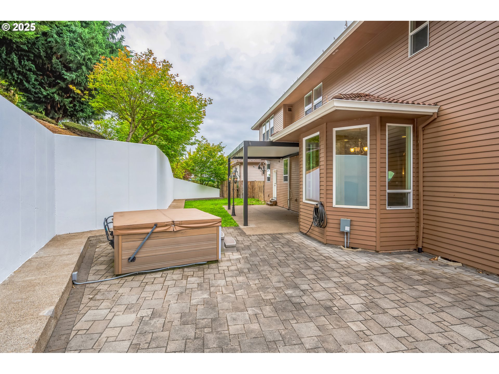 9340 Southeast Emmert View Court Happy Valley, OR 97086 - Photo 8 of 42 a backyard of a house with table and chairs