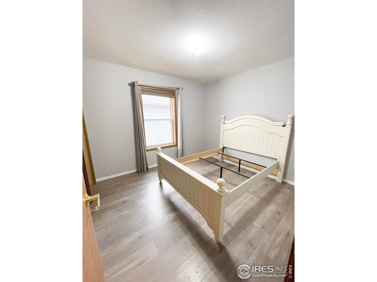 4200 Paintbrush Drive Evans, CO 80620 - Photo 15 of 18 a living room with a couch and a stove top oven