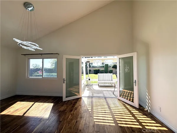 a room with balcony and wooden floor
