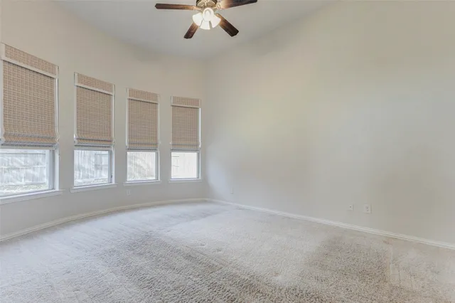 an empty room with a empty space and windows