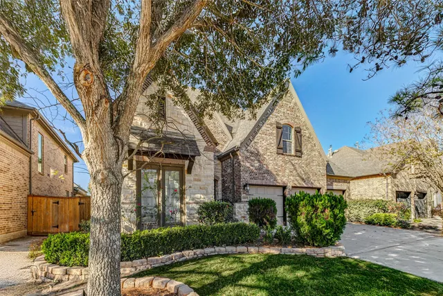 front view of a house with a garden