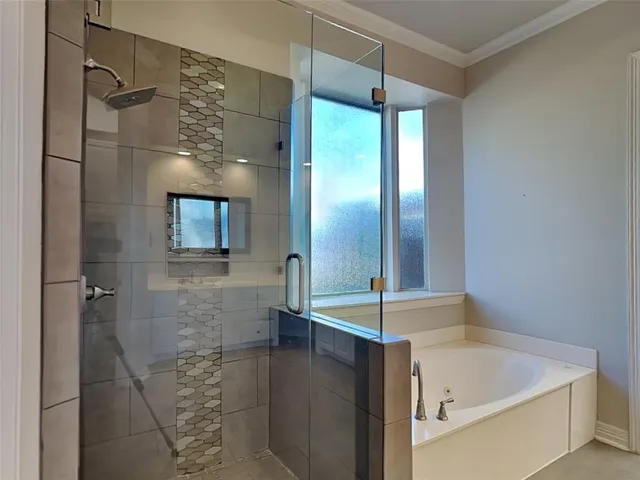 a bathroom with a bathtub and a sink