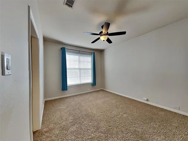 a view of empty room with windows