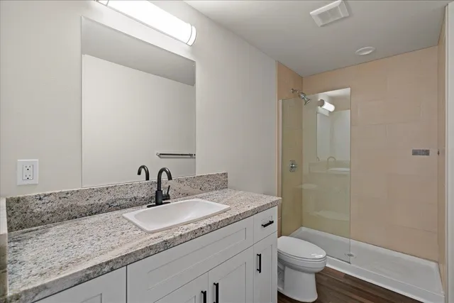 a bathroom with a sink and vanity