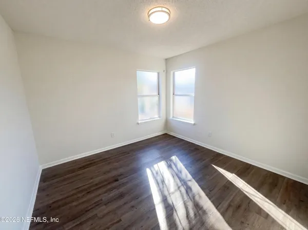 a view of entryway with wooden floor