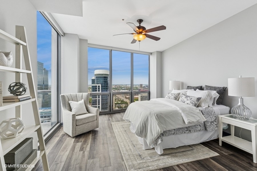 1235 South Prairie Avenue, Unit 3605 Chicago, IL 60605 - Photo 13 of 34 a bedroom with a bed and a couch