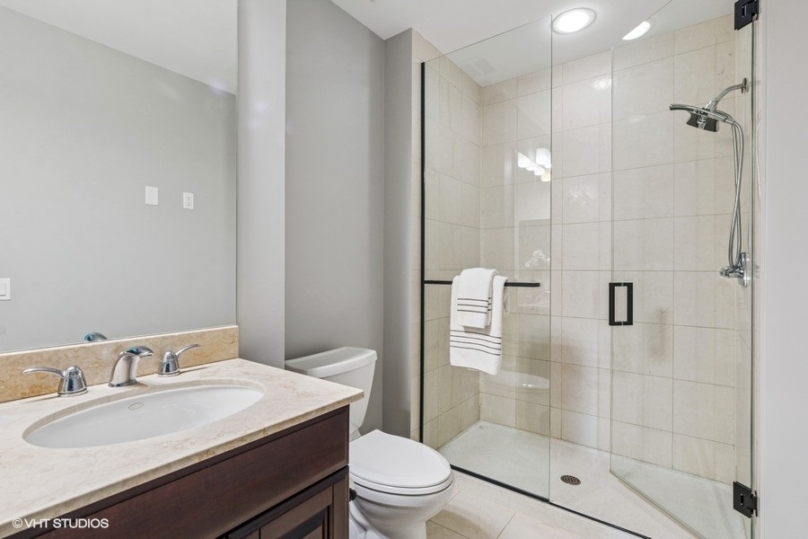 1235 South Prairie Avenue, Unit 3605 Chicago, IL 60605 - Photo 15 of 34 a bathroom with a sink a toilet and shower
