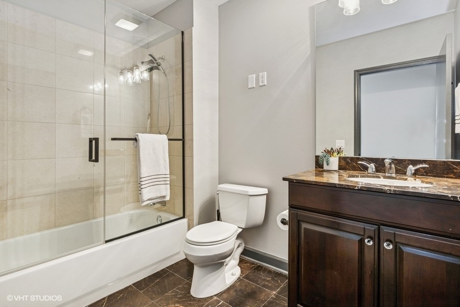 1235 South Prairie Avenue, Unit 3605 Chicago, IL 60605 - Photo 22 of 34 a bathroom with a sink toilet and shower