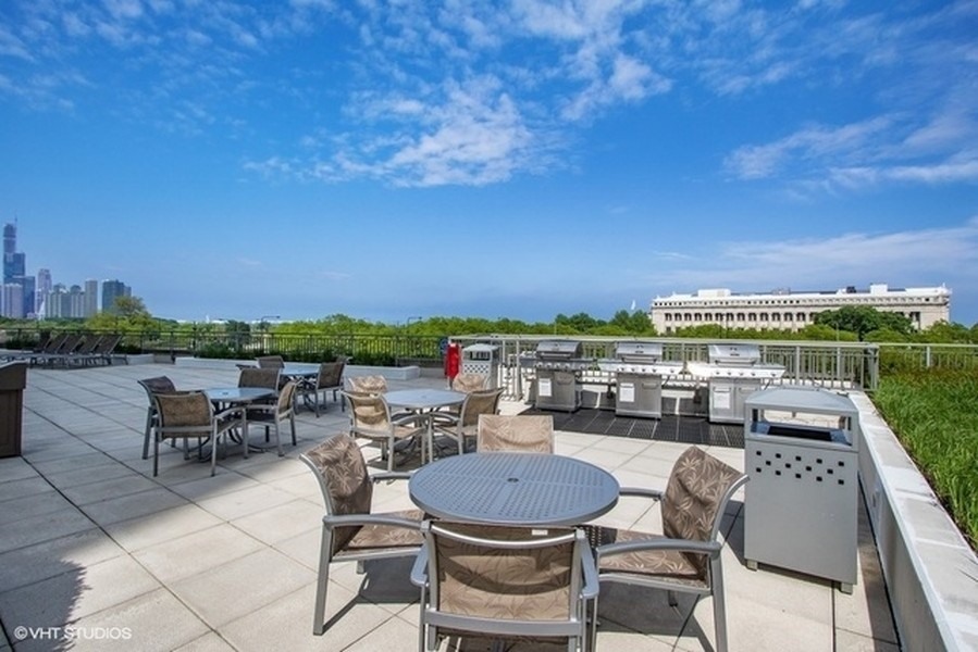 1235 South Prairie Avenue, Unit 3605 Chicago, IL 60605 - Photo 26 of 34 a balcony with a table and chairs