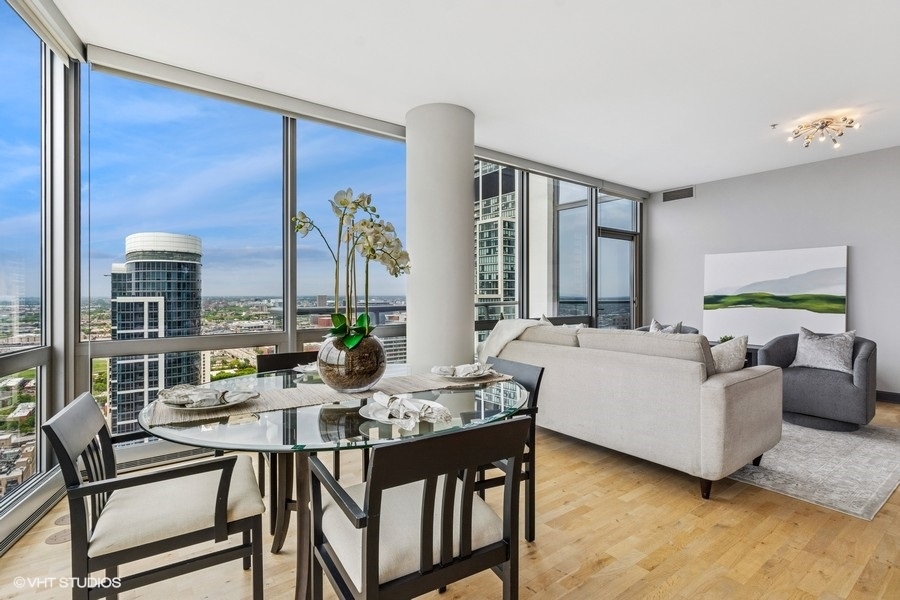 1235 South Prairie Avenue, Unit 3605 Chicago, IL 60605 - Photo 5 of 34 a living room with furniture and large windows