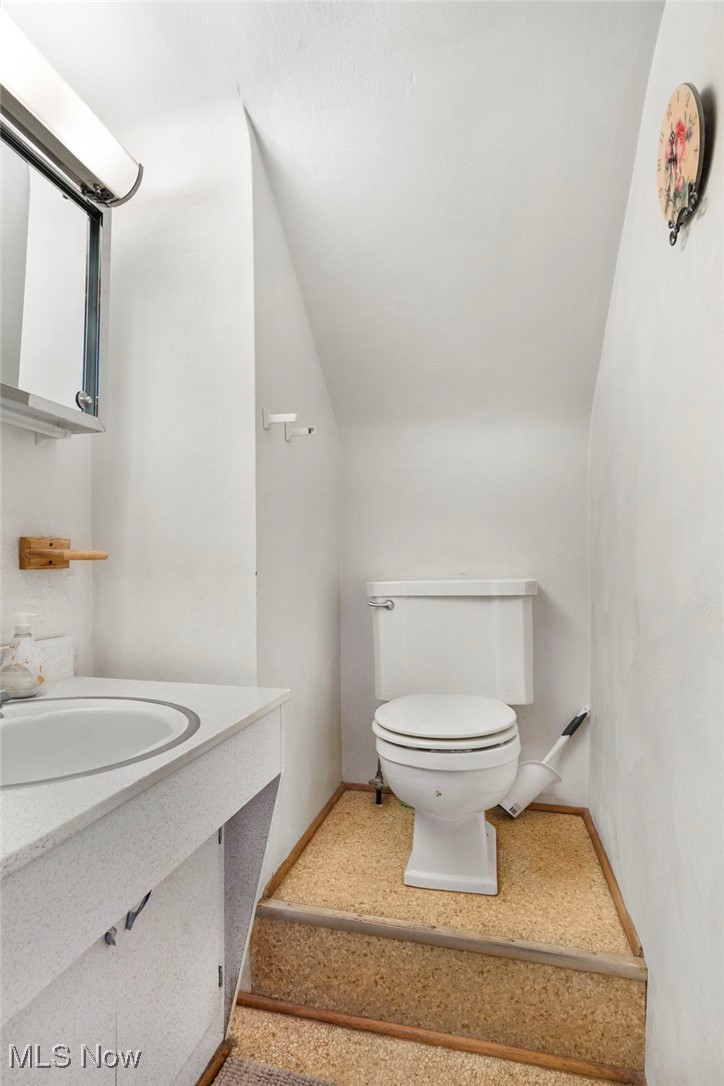 3002 Joseph Street Northwest Canton, OH 44708 - Photo 15 of 18 Bathroom featuring lofted ceiling and vanity