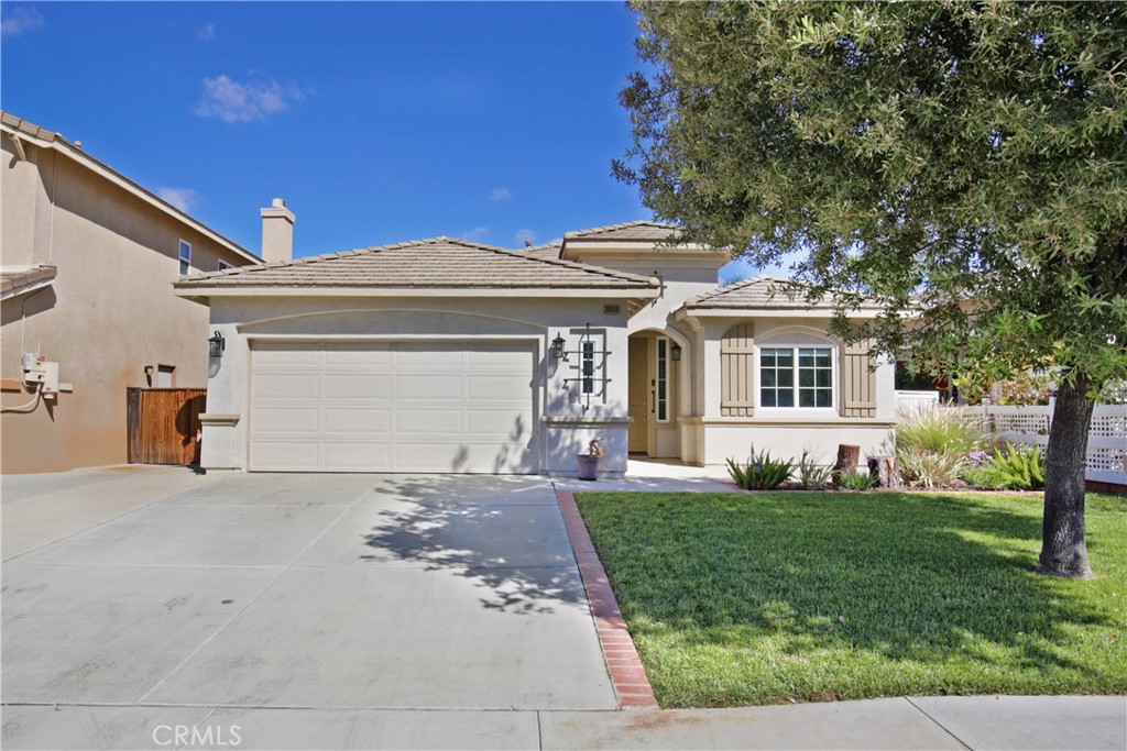 30096 Diamond Ridge Court Menifee, CA 92585 - Photo 1 of 1 a front view of a house with a yard and trees