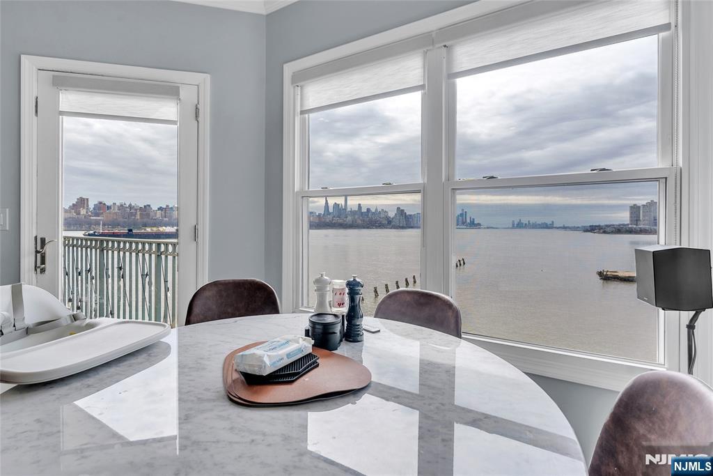 314 The Promenade Edgewater, NJ 07020 - Photo 12 of 37 a living room with furniture and a large window