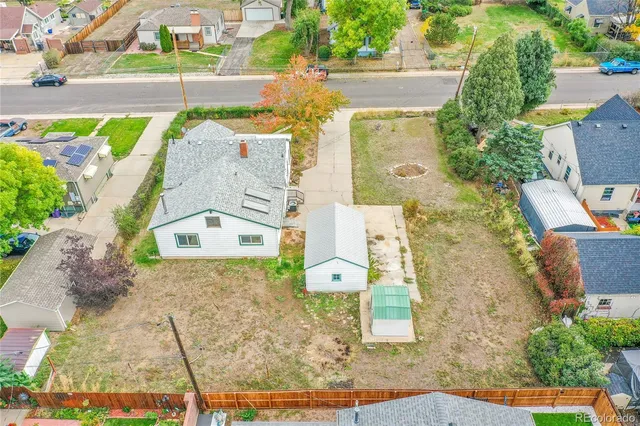an aerial view of a house with a swimming pool