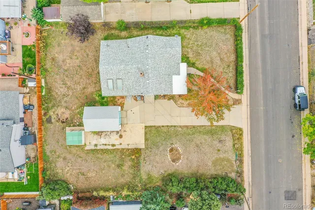 an aerial view of residential house with outdoor space and parking
