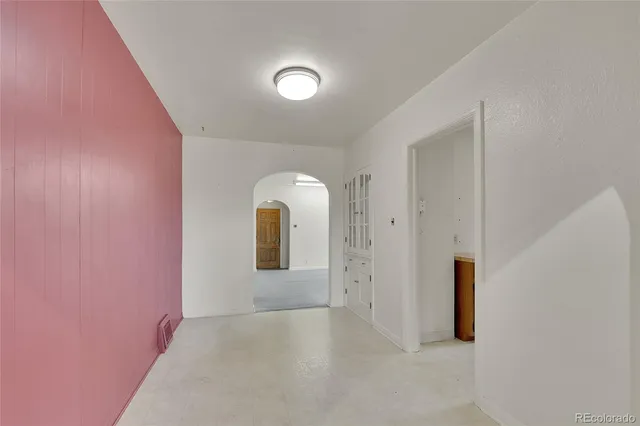 a view of a livingroom with wooden floor and window