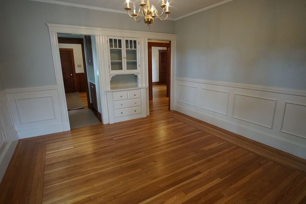 754 Massachusetts Avenue, Unit 1 Lexington, MA 02421 - Photo 6 of 17 a view of room with wooden floor