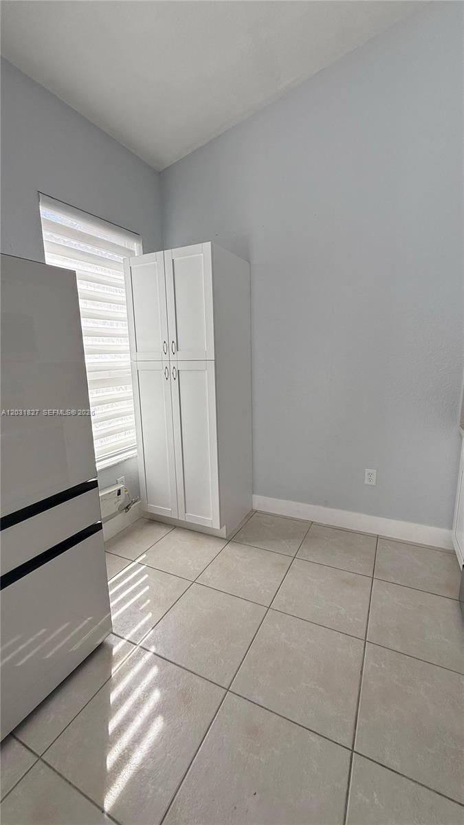 2120 Northeast 37th Road, Unit 1 Homestead, FL 33033 - Photo 20 of 30 a view of a livingroom with an empty space and a window