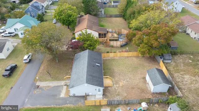 an aerial view of residential houses with outdoor space