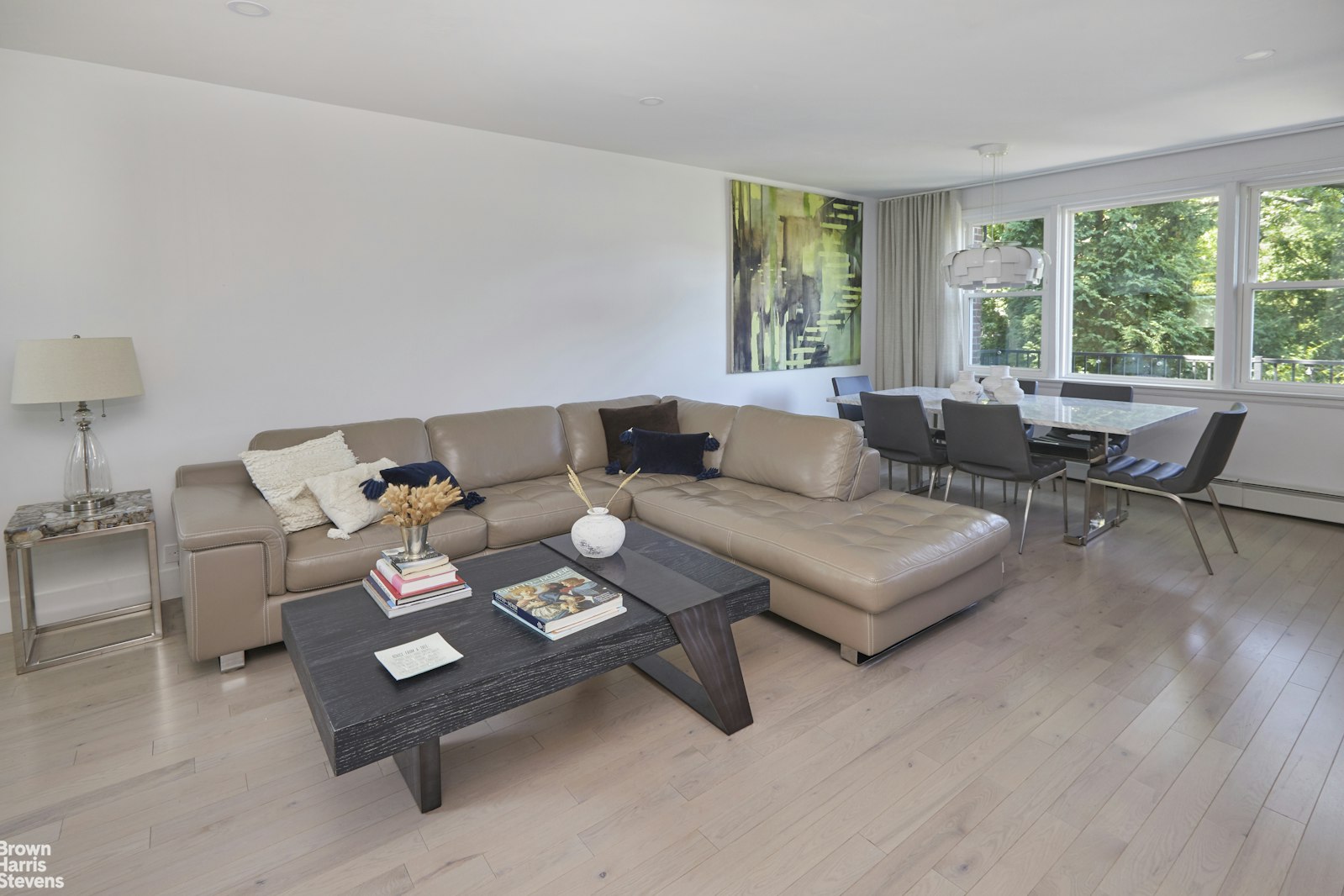 4601 Henry Hudson Parkway West, Unit A7 Bronx, NY 10471 - Photo 10 of 24 a living room with furniture and a large window