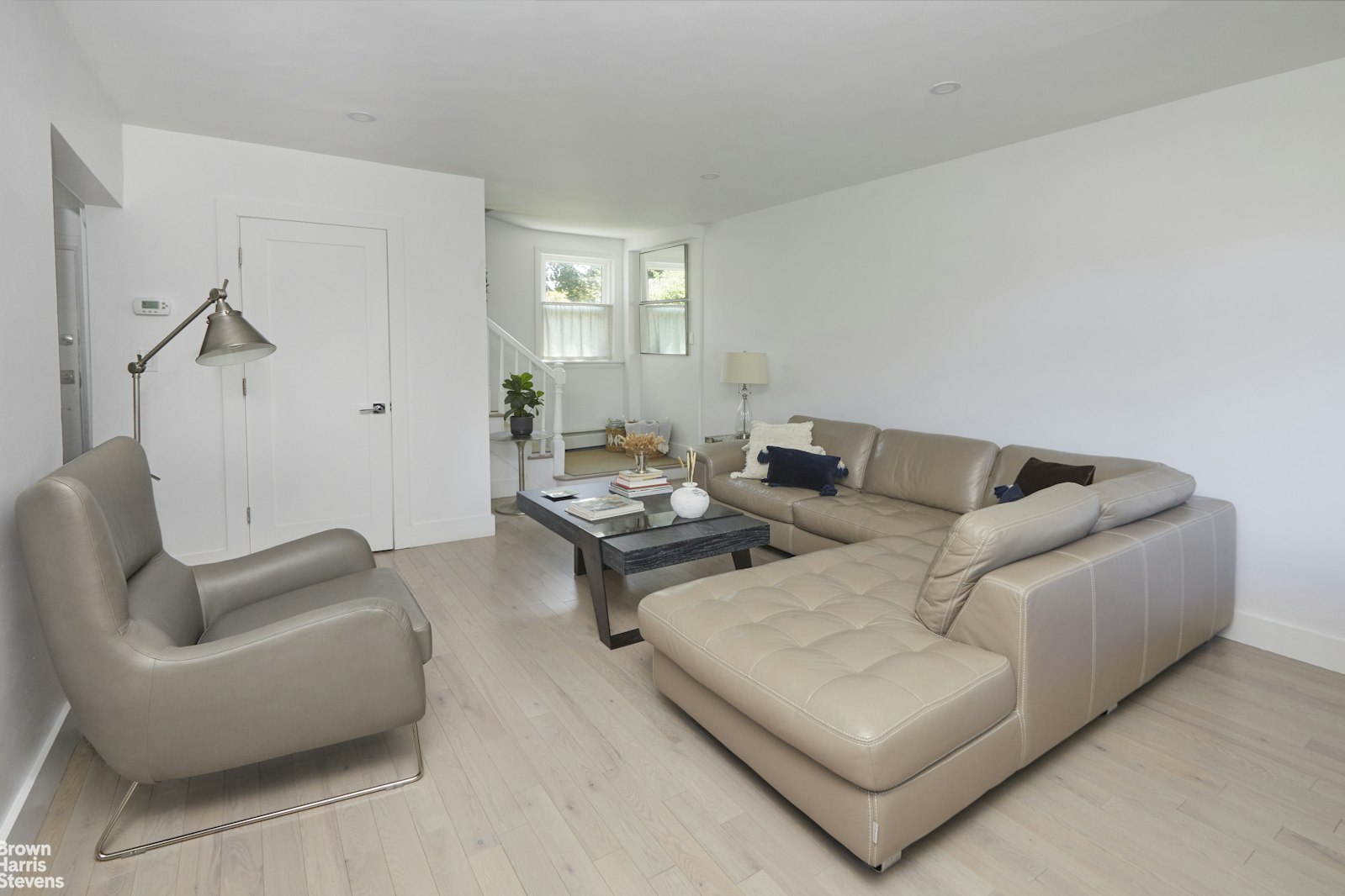 4601 Henry Hudson Parkway West, Unit A7 Bronx, NY 10471 - Photo 11 of 24 a living room with furniture and a potted plant