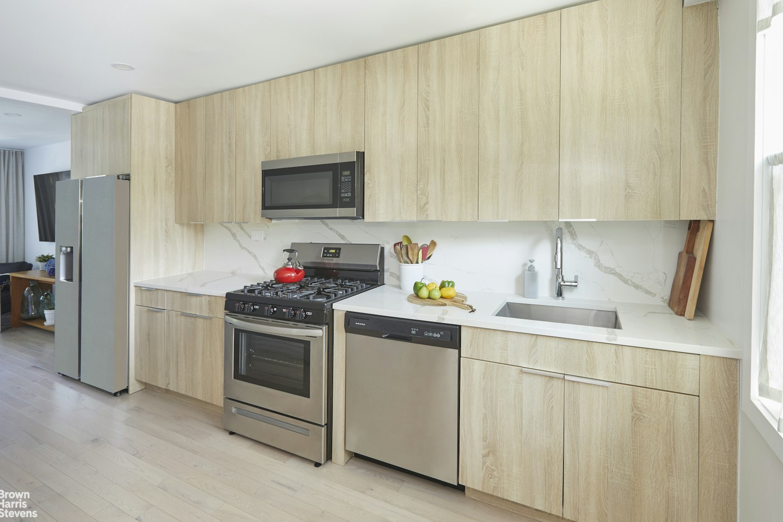 4601 Henry Hudson Parkway West, Unit A7 Bronx, NY 10471 - Photo 13 of 24 a kitchen with stainless steel appliances a stove a sink and a refrigerator