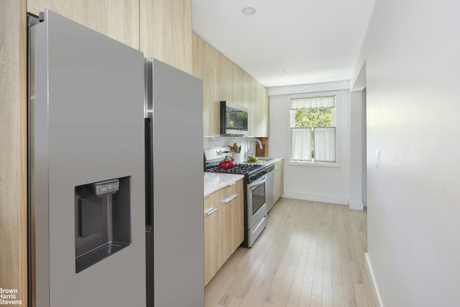 4601 Henry Hudson Parkway West, Unit A7 Bronx, NY 10471 - Photo 14 of 24 a kitchen with a refrigerator and a sink