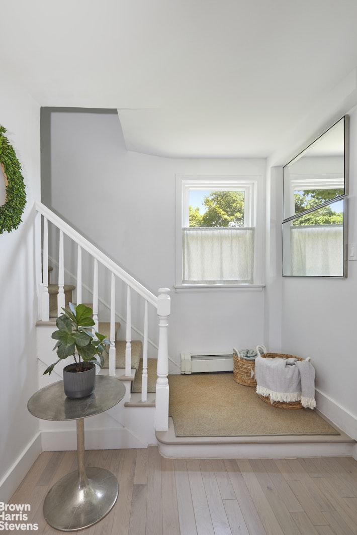 4601 Henry Hudson Parkway West, Unit A7 Bronx, NY 10471 - Photo 17 of 24 a living room with furniture and a potted plant