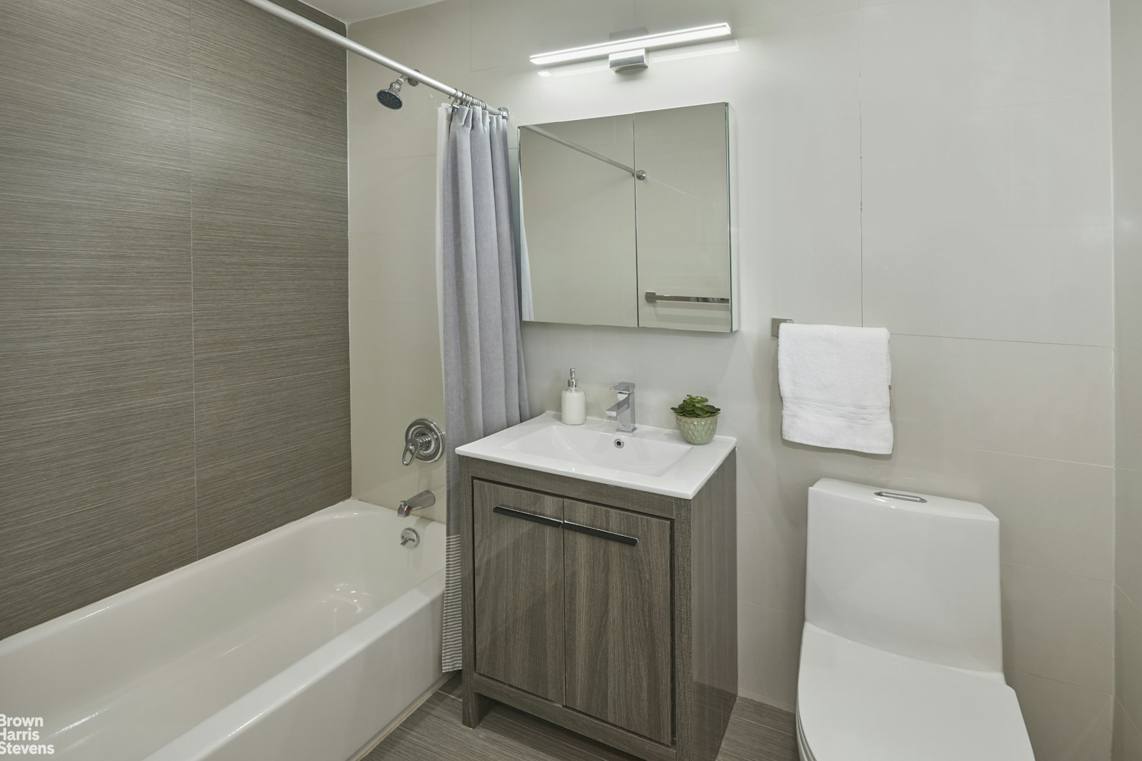 4601 Henry Hudson Parkway West, Unit A7 Bronx, NY 10471 - Photo 20 of 24 a bathroom with a sink a toilet and shower