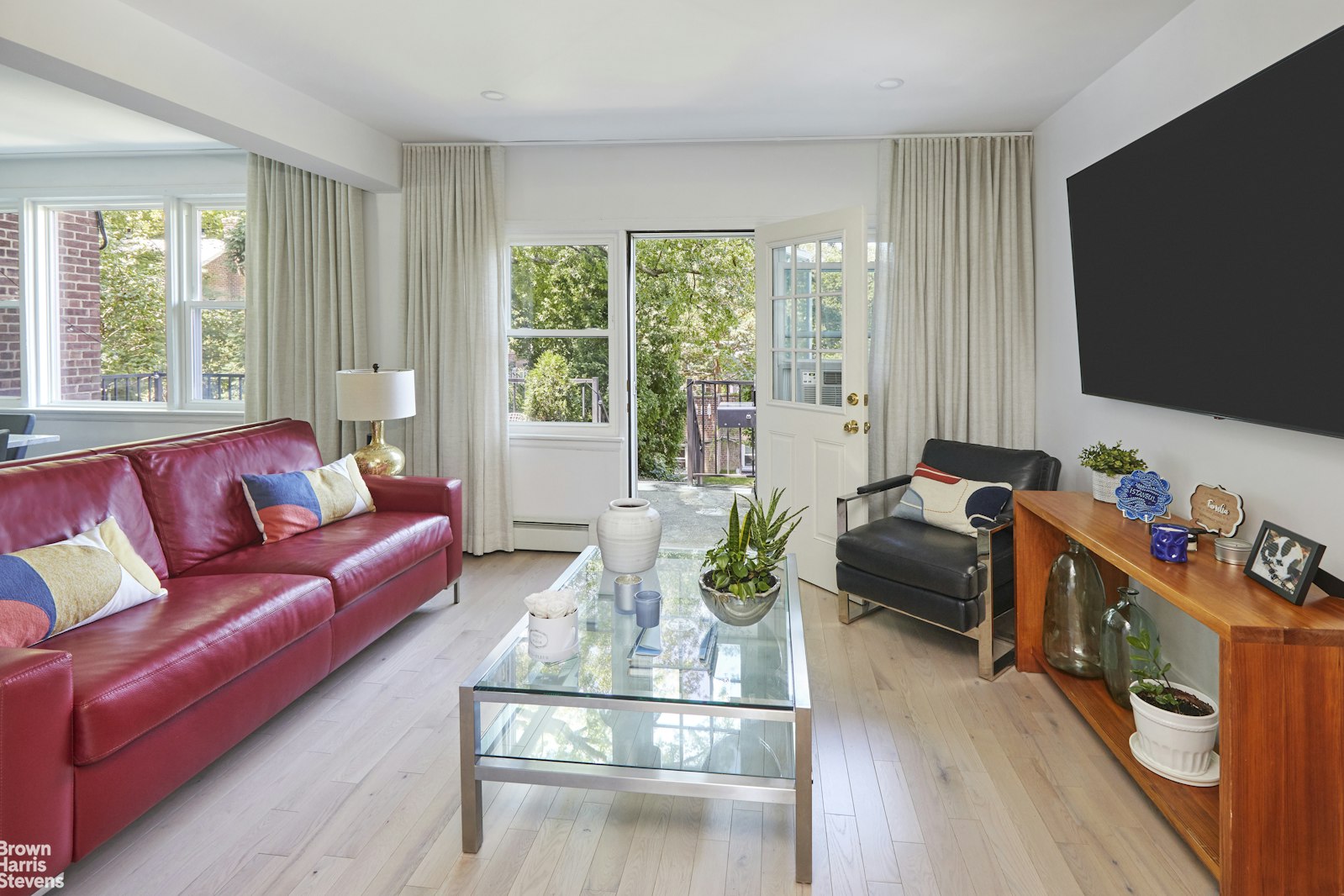 4601 Henry Hudson Parkway West, Unit A7 Bronx, NY 10471 - Photo 8 of 24 a living room with furniture fireplace and flat screen tv