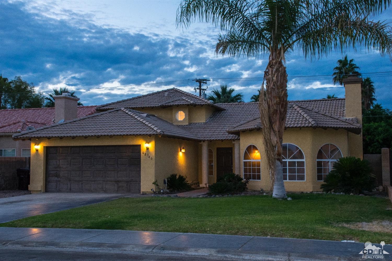 68340 Tortuga Road Cathedral City, CA 92234 - Photo 1 of 37 a front view of a house with a garden