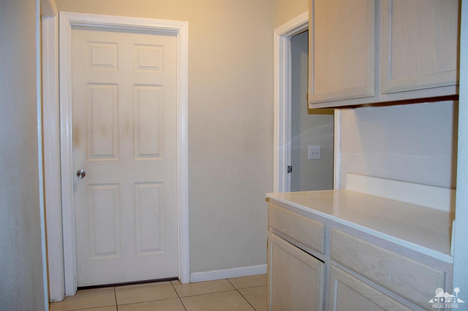 68340 Tortuga Road Cathedral City, CA 92234 - Photo 20 of 37 a view of bathroom with washer and dryer