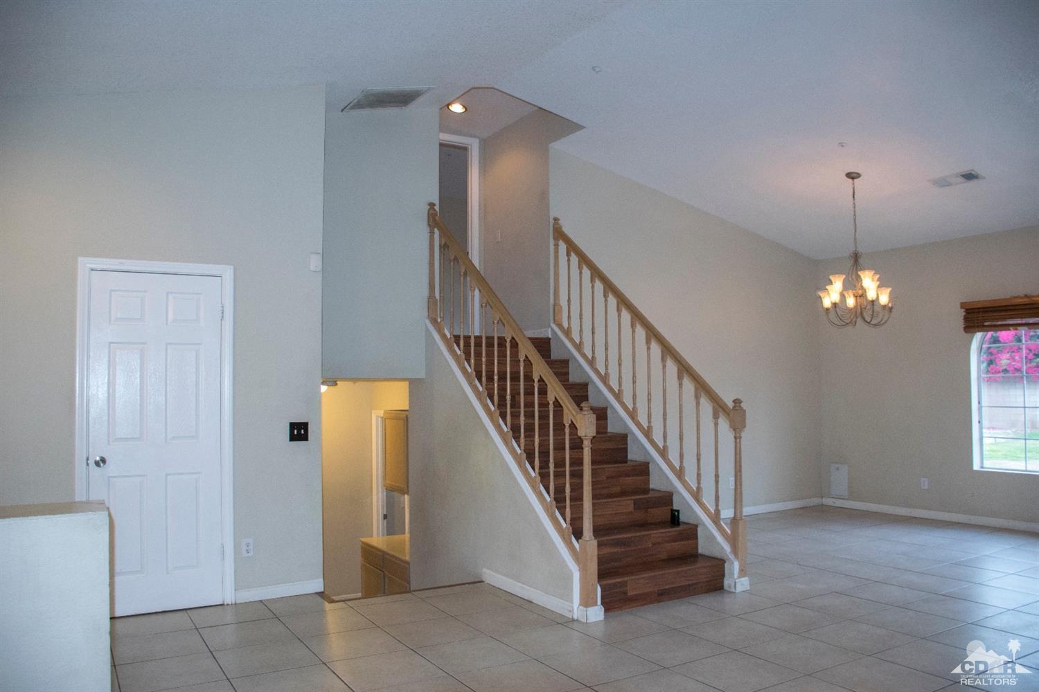 68340 Tortuga Road Cathedral City, CA 92234 - Photo 21 of 37 a view of a hallway with windows and entryway