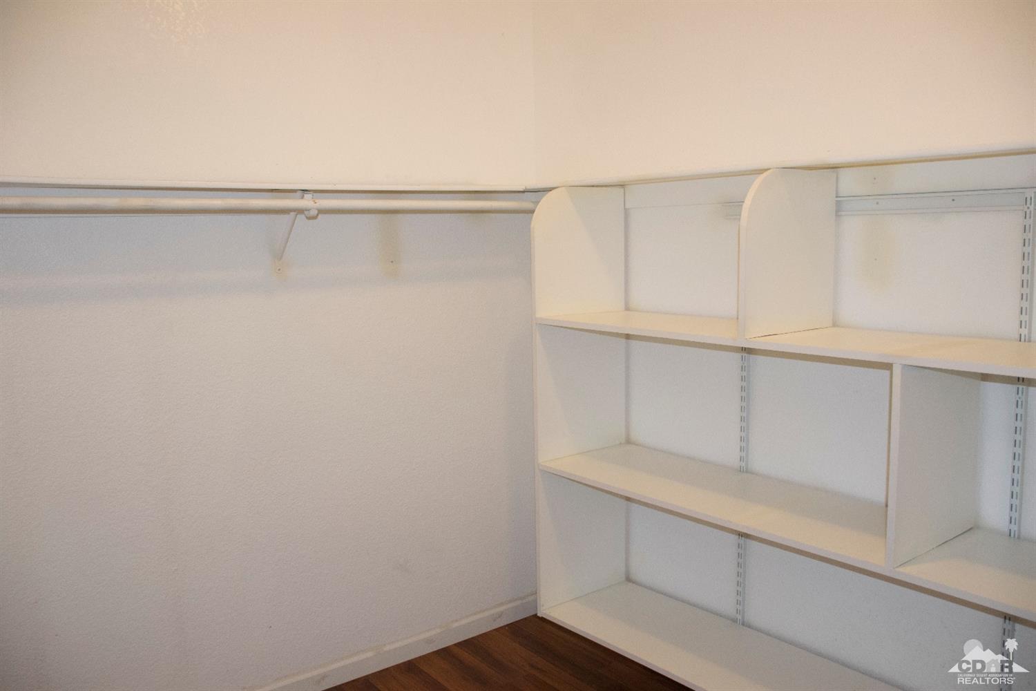 68340 Tortuga Road Cathedral City, CA 92234 - Photo 26 of 37 a view of an empty walk in closet