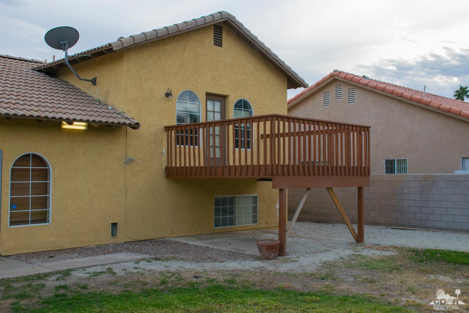 68340 Tortuga Road Cathedral City, CA 92234 - Photo 33 of 37 a view of front of house with a yard