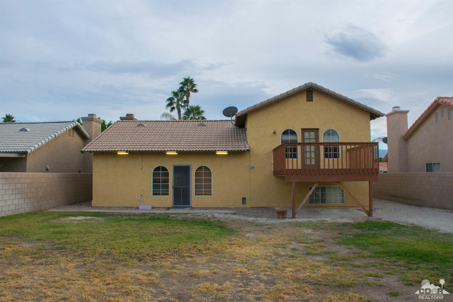 68340 Tortuga Road Cathedral City, CA 92234 - Photo 34 of 37 a view of a house with a yard