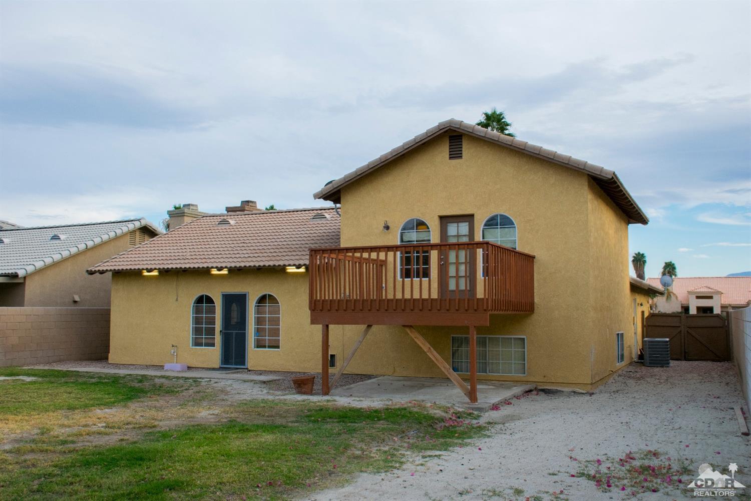 68340 Tortuga Road Cathedral City, CA 92234 - Photo 35 of 37 a view of a house with backyard and a tree
